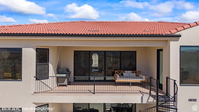 3218 E Rimrunner Dr, St George, UT 84790 - back of house with stucco siding, a balcony, and a tile roof