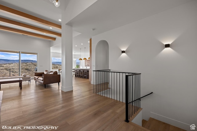 3218 E Rimrunner Dr, St George, UT 84790 - corridor with an upstairs landing, beamed ceiling, recessed lighting, and wood finished floors