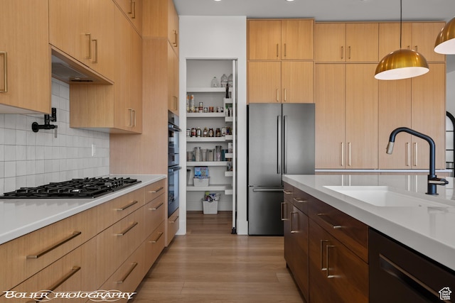 3218 E Rimrunner Dr, St George, UT 84790 - kitchen with a sink, gas cooktop, freestanding refrigerator, light countertops, and dishwasher