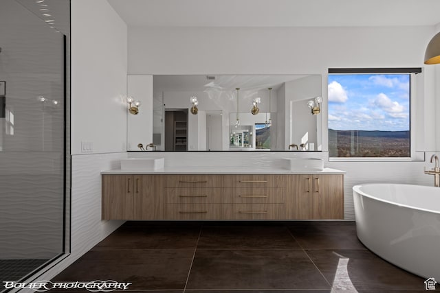 3218 E Rimrunner Dr, St George, UT 84790 - full bath with double vanity, a soaking tub, a stall shower, and a sink