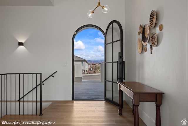 3218 E Rimrunner Dr, St George, UT 84790 - foyer featuring baseboards, an inviting chandelier, and wood finished floors