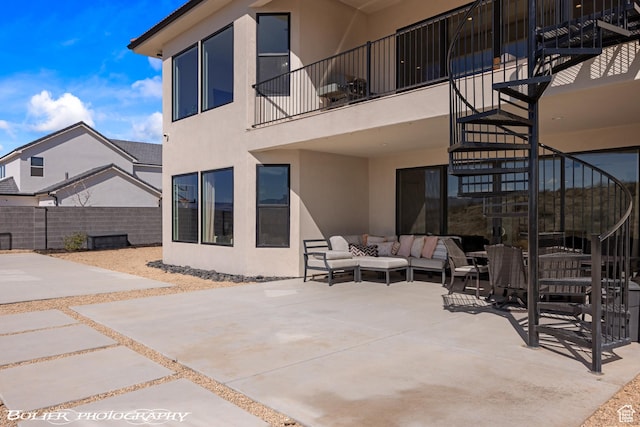 3218 E Rimrunner Dr, St George, UT 84790 - view of patio / terrace featuring stairway, an outdoor hangout area, a balcony, and fence