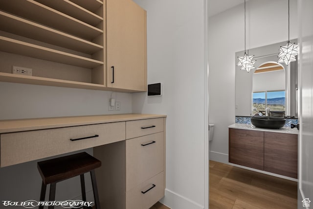3218 E Rimrunner Dr, St George, UT 84790 - kitchen with a sink, light countertops, wood finished floors, modern cabinets, and open shelves