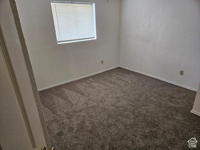5063 S 2825 W, Roy, UT 84067 - carpeted empty room with a textured wall