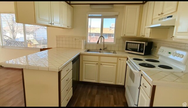 5063 S 2825 W, Roy, UT 84067 - kitchen with a sink, tile counters, white electric range, under cabinet range hood, and dark wood-style flooring