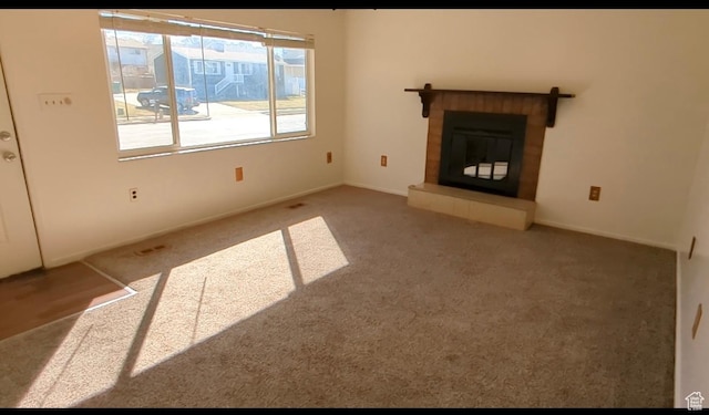 5063 S 2825 W, Roy, UT 84067 - unfurnished living room with a tiled fireplace and carpet