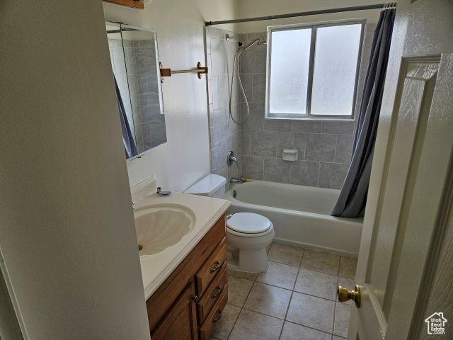 5063 S 2825 W, Roy, UT 84067 - full bath with shower / bath combination with curtain, tile patterned floors, vanity, and toilet
