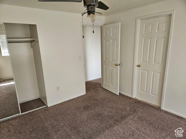5063 S 2825 W, Roy, UT 84067 - unfurnished bedroom with carpet floors, baseboards, and ceiling fan