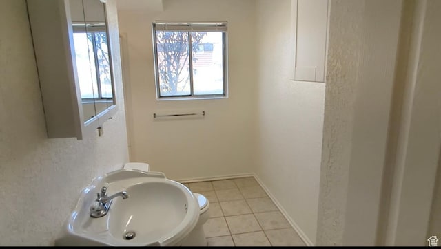 5063 S 2825 W, Roy, UT 84067 - bathroom featuring tile patterned flooring, a sink, and baseboards