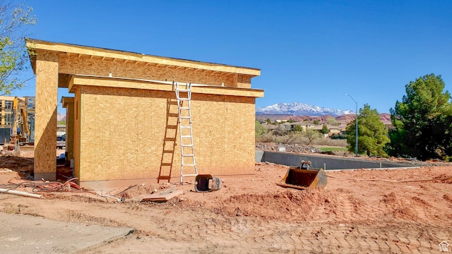 view of home's exterior featuring stucco siding and a mountain view