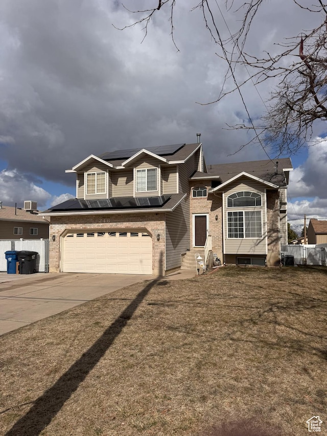 view of front facade with a garage, brick siding, concrete driveway, and entry steps