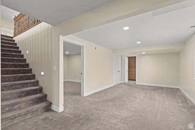 basement with visible vents, baseboards, carpet floors, recessed lighting, and stairs