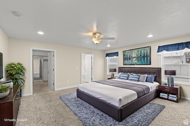 bedroom featuring recessed lighting, light colored carpet, and baseboards