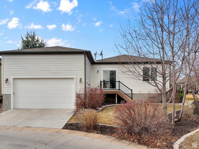 11709 S Grandville Ave, South Jordan, UT 84009 - ranch-style house featuring concrete driveway and an attached garage
