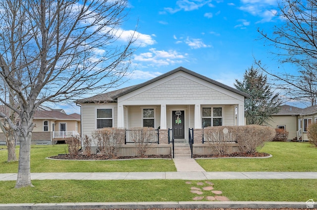 11709 S Grandville Ave, South Jordan, UT 84009 - view of front of house featuring a porch and a front yard