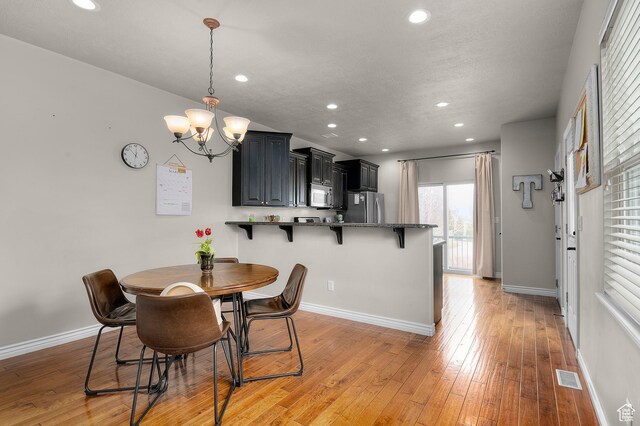 11709 S Grandville Ave, South Jordan, UT 84009 - dining space with recessed lighting, a chandelier, and light wood-style floors