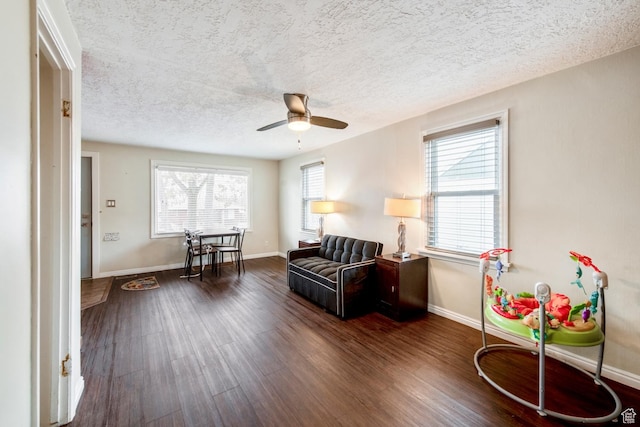 2348 Iowa Ave, Ogden, UT 84401 - living area with baseboards, dark wood-type flooring, ceiling fan, and a textured ceiling