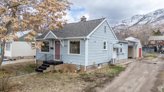 2348 Iowa Ave, Ogden, UT 84401 - bungalow-style house featuring a mountain view, a chimney, and roof with shingles