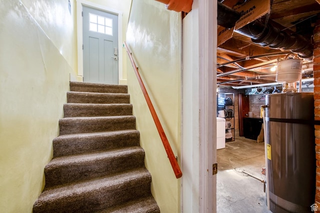 2348 Iowa Ave, Ogden, UT 84401 - stairway with washer / dryer, concrete flooring, and water heater