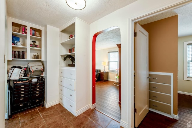 2348 Iowa Ave, Ogden, UT 84401 - walk in closet featuring arched walkways and dark wood-style floors