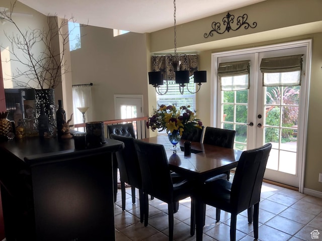 8377 S Wild Oak Dr, West Jordan, UT 84088 - dining room featuring light tile patterned floors, plenty of natural light, french doors, and an inviting chandelier