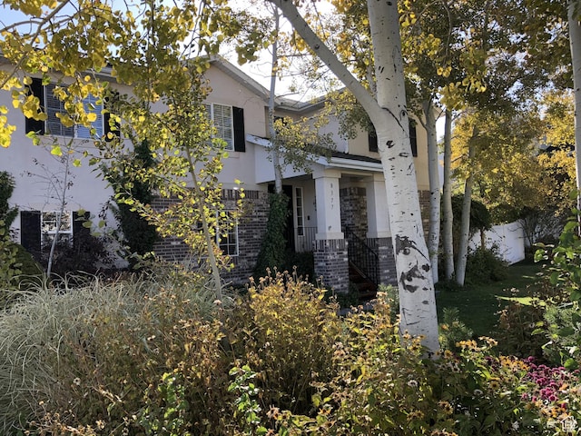 8377 S Wild Oak Dr, West Jordan, UT 84088 - view of front of house with fence and brick siding