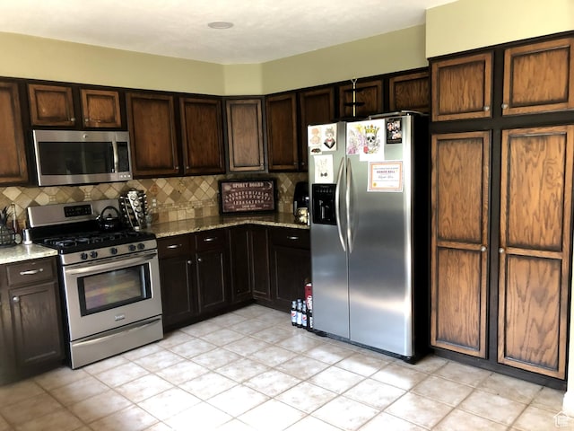 8377 S Wild Oak Dr, West Jordan, UT 84088 - kitchen with tasteful backsplash, dark brown cabinets, stainless steel appliances, and light stone counters