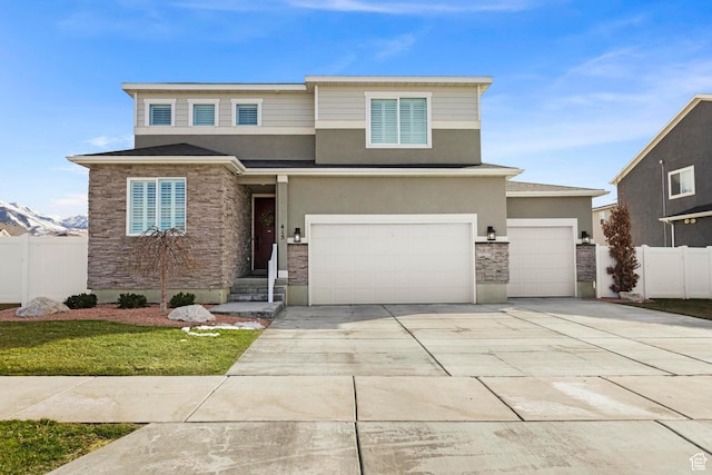 415 W 1410 N Unit 81, Tooele, UT 84074 - prairie-style house featuring stucco siding, stone siding, driveway, and fence