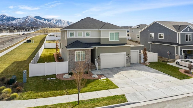 415 W 1410 N Unit 81, Tooele, UT 84074 - view of front facade featuring concrete driveway, fence, and stucco siding