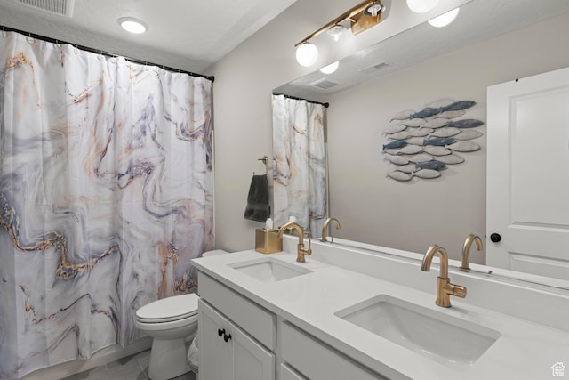 415 W 1410 N Unit 81, Tooele, UT 84074 - bathroom featuring double vanity, toilet, visible vents, and a sink