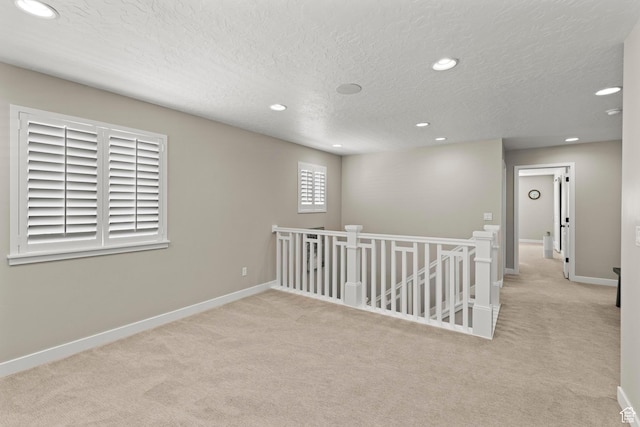 415 W 1410 N Unit 81, Tooele, UT 84074 - empty room featuring recessed lighting, baseboards, carpet, and a textured ceiling