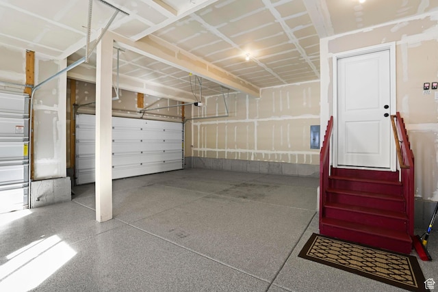 415 W 1410 N Unit 81, Tooele, UT 84074 - garage with electric panel and a garage door opener