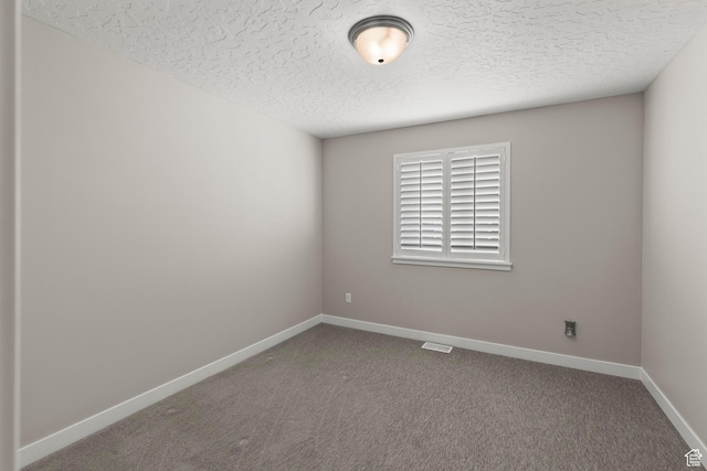 415 W 1410 N Unit 81, Tooele, UT 84074 - empty room with baseboards, carpet floors, a textured ceiling, and visible vents