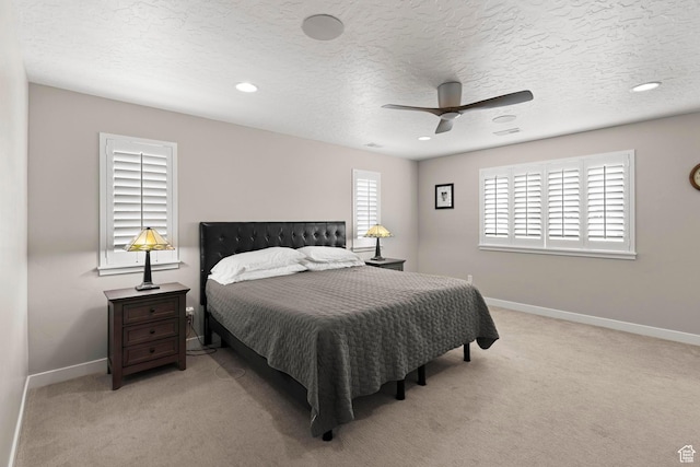 415 W 1410 N Unit 81, Tooele, UT 84074 - bedroom with baseboards, light carpet, and a textured ceiling