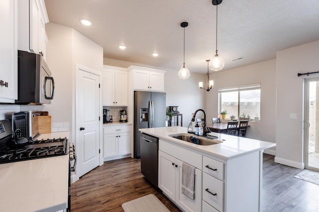 3084 W 1750 N Unit 1, Cedar City, UT 84721 - kitchen featuring a sink, stainless steel appliances, dark wood-style floors, and decorative backsplash