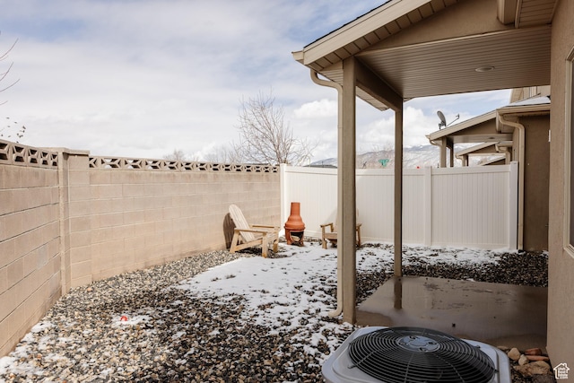 3084 W 1750 N Unit 1, Cedar City, UT 84721 - snow covered patio featuring a fenced backyard and central AC