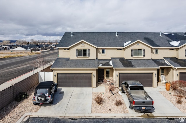 3084 W 1750 N Unit 1, Cedar City, UT 84721 - view of front of house with concrete driveway, an attached garage, and stucco siding