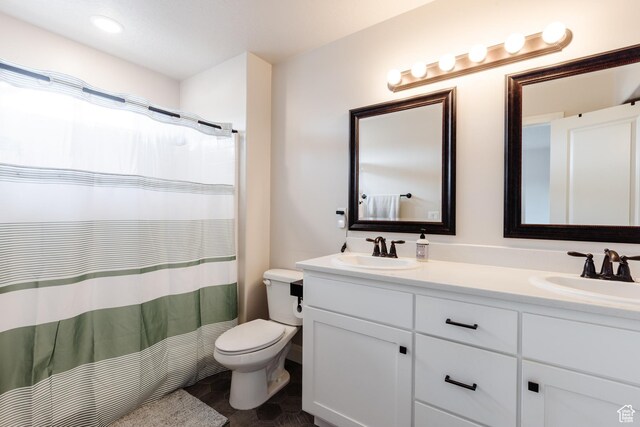 3084 W 1750 N Unit 1, Cedar City, UT 84721 - bathroom featuring double vanity, curtained shower, toilet, and a sink