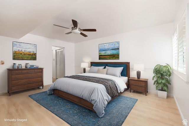 1525 E Waterbury Dr Unit D, Salt Lake City, UT 84121 - bedroom featuring light wood finished floors, baseboards, ceiling fan, and a closet