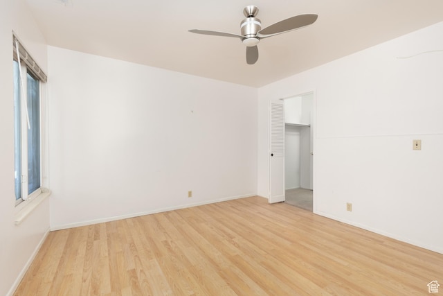 1525 E Waterbury Dr Unit D, Salt Lake City, UT 84121 - empty room featuring light wood-style floors, a ceiling fan, and baseboards