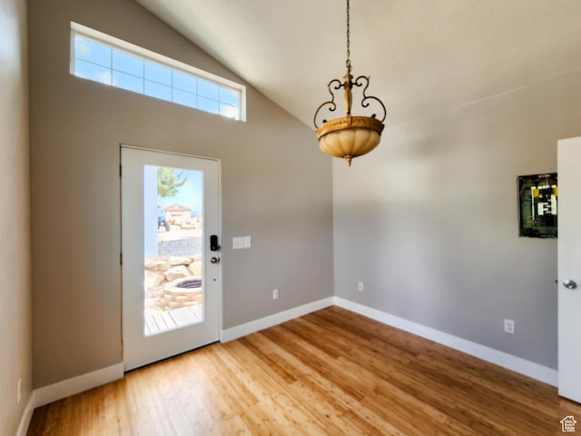 3030 S Edgemont Dr Unit 159, Garden City, UT 84028 - entrance foyer featuring vaulted ceiling, baseboards, and wood finished floors