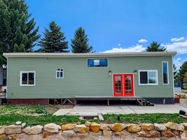 3030 S Edgemont Dr Unit 159, Garden City, UT 84028 - back of property with entry steps and a patio