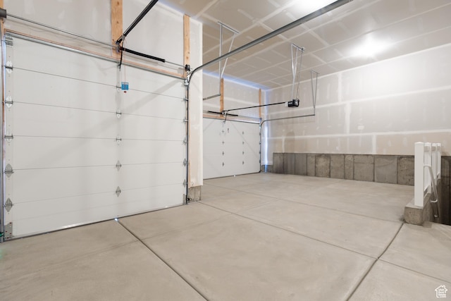 3077 N 2875 W Unit 5, Plain City, UT 84404 - garage featuring a garage door opener