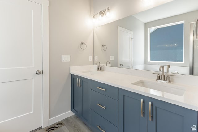 3077 N 2875 W Unit 5, Plain City, UT 84404 - bathroom featuring baseboards, visible vents, a sink, and double vanity