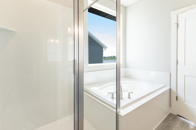 3077 N 2875 W Unit 5, Plain City, UT 84404 - full bathroom featuring a shower stall, a bath, and wood finished floors