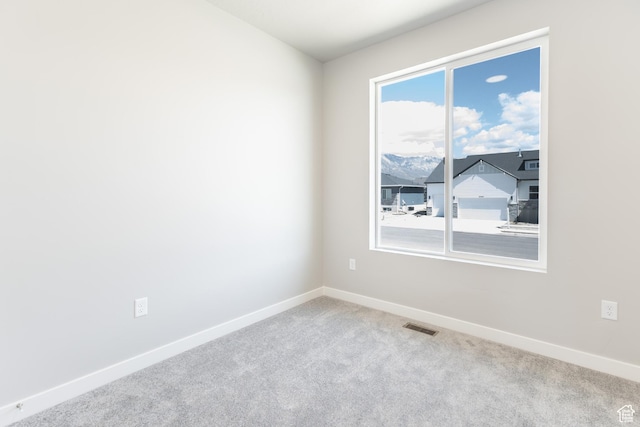 3077 N 2875 W Unit 5, Plain City, UT 84404 - empty room featuring carpet flooring, baseboards, and visible vents