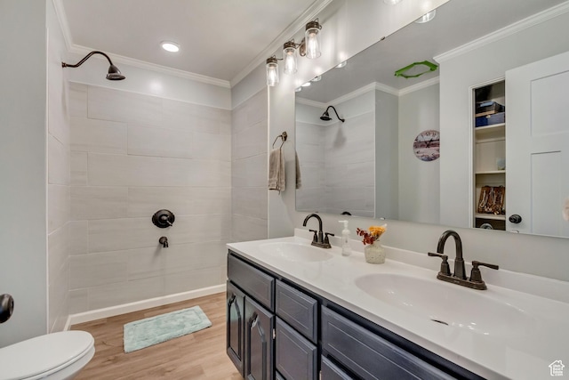 817 W Lucky Clover Ln, Murray, UT 84123 - bathroom featuring crown molding, wood finished floors, a tile shower, and a sink
