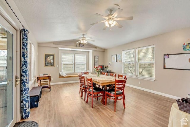 817 W Lucky Clover Ln, Murray, UT 84123 - dining area with baseboards, light wood-type flooring, vaulted ceiling, a textured ceiling, and a ceiling fan