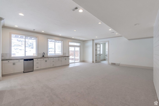 6264 W Skyline Dr N, Highland, UT 84003 - interior space featuring baseboards, recessed lighting, white cabinetry, a sink, and light colored carpet