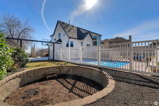 6264 W Skyline Dr N, Highland, UT 84003 - rear view of house with stucco siding, fence, and a fenced in pool